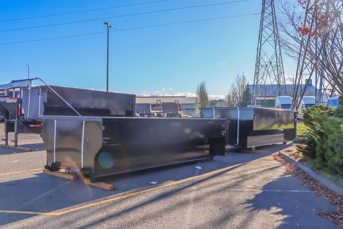 Roll-off dumpster ready for waste disposal at job site for 6 Yard Dumpster Rental in Nashua